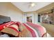 Cozy bedroom with views of the outside living area offers natural light and space at 41225 N River Bend Rd, Phoenix, AZ 85086