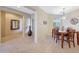 Dining room features a wood table, neutral walls, tiled floors, and natural lighting at 41225 N River Bend Rd, Phoenix, AZ 85086