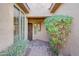 The covered front entry leads to the front door with beautiful desert landscaping at 41225 N River Bend Rd, Phoenix, AZ 85086