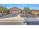 Charming single-story home featuring a desert landscape, two-car garage, and tile roof at 41225 N River Bend Rd, Phoenix, AZ 85086