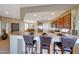 Well-lit kitchen with breakfast bar and stainless steel appliances open to dining area at 41225 N River Bend Rd, Phoenix, AZ 85086