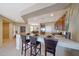 Open kitchen with stainless appliances and a breakfast bar connected to the dining area at 41225 N River Bend Rd, Phoenix, AZ 85086