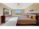 Bright main bedroom featuring a large window with views of the desert landscape at 41225 N River Bend Rd, Phoenix, AZ 85086