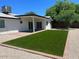 Beautiful backyard featuring artificial turf and gravel for a low-maintenance outdoor living space at 4215 W Villa Rita Dr, Glendale, AZ 85308