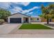 Charming single-story home with a manicured lawn and a two-car garage at 4215 W Villa Rita Dr, Glendale, AZ 85308