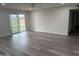 Bright living room with modern flooring and sliding glass doors leading to the outdoors at 4215 W Villa Rita Dr, Glendale, AZ 85308