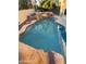 Gorgeous in-ground pool featuring rock waterfall, stone accents and desert landscaping at 4336 E Encanto St, Mesa, AZ 85205