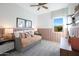 Cozy bedroom features a daybed with decorative pillows, stylish lighting, and soothing neutral color palette at 44323 N 43Rd Dr, Phoenix, AZ 85087