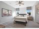 Serene main bedroom features neutral tones, soft carpet, natural light, and stylish decor for relaxation at 44323 N 43Rd Dr, Phoenix, AZ 85087