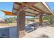 Community picnic area featuring a covered picnic table and playground nearby at 44323 N 43Rd Dr, Phoenix, AZ 85087