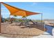 Community playground with a sunshade that features slides and climbing structures at 44323 N 43Rd Dr, Phoenix, AZ 85087