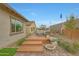 Backyard with a wooden deck featuring outdoor seating and a charming fire pit at 44409 N 43Rd Dr, Phoenix, AZ 85087