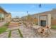 Beautiful backyard featuring a fireplace and outdoor seating, perfect for relaxation at 44409 N 43Rd Dr, Phoenix, AZ 85087