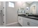 Bright bathroom featuring patterned floor tile, neutral walls and a dual sink vanity at 44409 N 43Rd Dr, Phoenix, AZ 85087