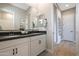 Bathroom featuring a double vanity, stylish mirrors, and a decorative orchid centerpiece at 44409 N 43Rd Dr, Phoenix, AZ 85087