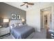 Serene main bedroom showcasing a plush bed, neutral tones, and modern nightstands at 44409 N 43Rd Dr, Phoenix, AZ 85087