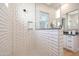 Modern tile shower with overhead shower and decorative inset niche at 44409 N 43Rd Dr, Phoenix, AZ 85087