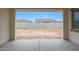 View of the property's spacious backyard, enclosed by a block wall for privacy at 44717 N 44Th Dr, Phoenix, AZ 85087