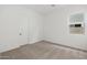 Neutral bedroom with carpeted floors, window offering natural light, and a closet at 44717 N 44Th Dr, Phoenix, AZ 85087