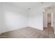 Bright bedroom with neutral carpet and view into the hallway and ensuite bathroom at 44717 N 44Th Dr, Phoenix, AZ 85087