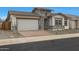 Charming home featuring a brick driveway, stone accents, and a two-car garage at 44717 N 44Th Dr, Phoenix, AZ 85087