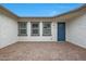 Inviting outdoor patio space with a stylish brick floor and a welcoming entrance at 44717 N 44Th Dr, Phoenix, AZ 85087