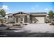 Charming single-story home with a desert landscape, brick accents, and a two-car garage at 44721 N 44Th Dr, Phoenix, AZ 85087