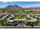 An elevated view captures the community layout, lush landscaping, and mountain views beyond at 5682 N Scottsdale Rd, Paradise Valley, AZ 85253