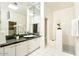 Modern bathroom with a sleek vanity, vessel sink, and tiled walk-in shower at 5682 N Scottsdale Rd, Paradise Valley, AZ 85253