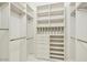 Walk-in closet with custom shelving, drawers, and ample storage space at 5682 N Scottsdale Rd, Paradise Valley, AZ 85253