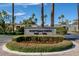 Community entrance featuring Scottsdale North signage, landscaping, and palm trees at 5682 N Scottsdale Rd, Paradise Valley, AZ 85253