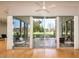 Expansive living room showcasing sliding glass doors that lead to an outdoor patio and manicured lawns at 5682 N Scottsdale Rd, Paradise Valley, AZ 85253