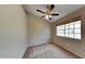 Bedroom with neutral walls, carpeted floor, window with blinds and a ceiling fan with lights at 625 S Westwood St # 108, Mesa, AZ 85210