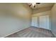 Bedroom with neutral walls, carpeted floor, vaulted ceiling, and double closets with doors at 625 S Westwood St # 108, Mesa, AZ 85210