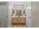 Bright bathroom features wood cabinets, double sinks and a vanity at 6915 E Gary Cir, Mesa, AZ 85207