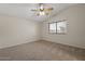 Bedroom featuring carpet, a ceiling fan and a window at 6915 E Gary Cir, Mesa, AZ 85207