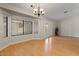 Bright dining room with hardwood floors, lots of natural light and double doors at 6915 E Gary Cir, Mesa, AZ 85207