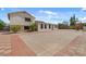 Exterior view of a white, two-story home and surrounding yard at 6915 E Gary Cir, Mesa, AZ 85207