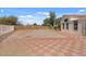 Exterior shot showcasing a spacious fenced yard with lush green trees around the perimeter at 6915 E Gary Cir, Mesa, AZ 85207