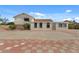 Exterior view showcasing a white, two-story home and surrounding yard and blue sky at 6915 E Gary Cir, Mesa, AZ 85207