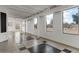 Bright living room with checkerboard tile, white walls, and ample natural light at 6915 E Gary Cir, Mesa, AZ 85207