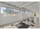 Bright living room with checkerboard tile, white walls, and ample natural light at 6915 E Gary Cir, Mesa, AZ 85207