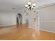 Open-concept living room flowing into the kitchen and featuring hardwood floors at 6915 E Gary Cir, Mesa, AZ 85207