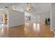 Spacious living room featuring gleaming hardwood floors, high ceilings and recessed lighting at 6915 E Gary Cir, Mesa, AZ 85207