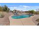 In-ground pool surrounded by secure fencing and a patio area with a table set at 6915 E Gary Cir, Mesa, AZ 85207