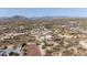 Neighborhood aerial showcasing desert homes and landscape with desert mountain views in the distance at 7100 E Montgomery Rd, Scottsdale, AZ 85266