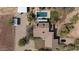 Aerial of a desert home featuring horse arena, pool, covered patio, and lush desert landscaping at 7100 E Montgomery Rd, Scottsdale, AZ 85266