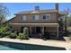 Back of home with a pool, shaded patio, and an array of greenery and plant life at 7100 E Montgomery Rd, Scottsdale, AZ 85266