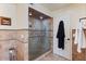 Modern bathroom shower with frameless glass door, tiled walls, and contemporary fixtures at 7100 E Montgomery Rd, Scottsdale, AZ 85266