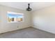 Neutral bedroom with carpeted floors and a large window letting in natural light at 7100 E Montgomery Rd, Scottsdale, AZ 85266